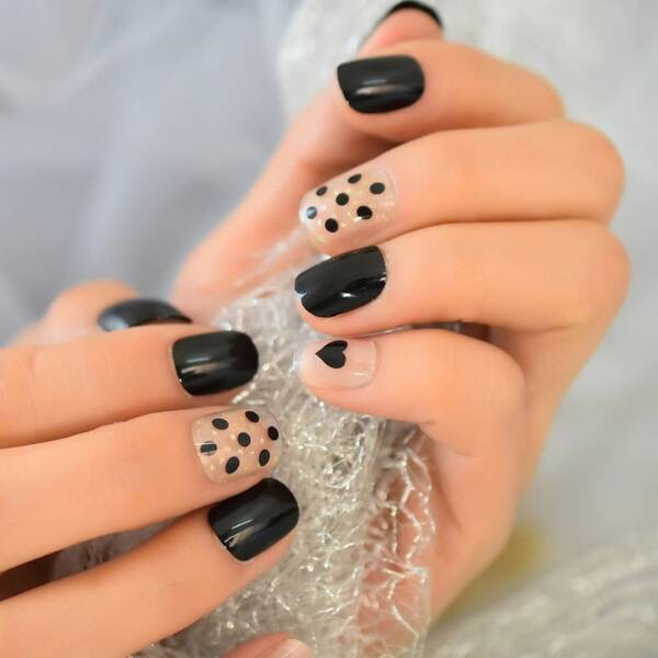 Black spots with hearts short nails.