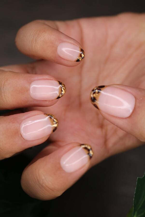 French tortoiseshell inspired with gold flakes short nails.