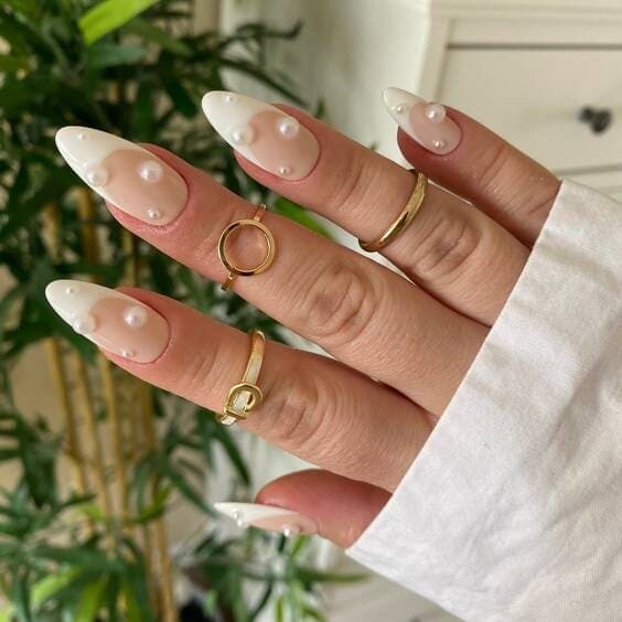 Pearly white nails with pearls.