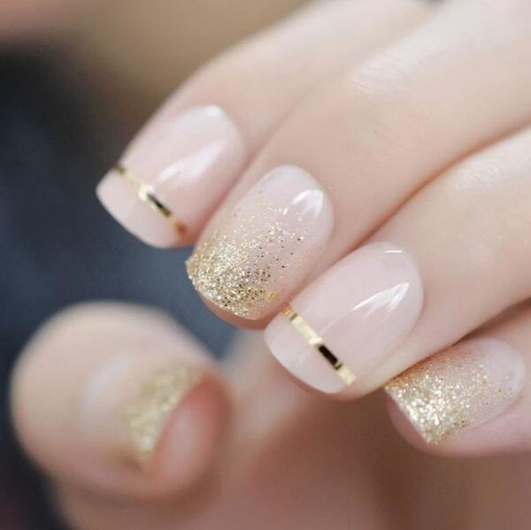 Gold glitter nude short square nails.