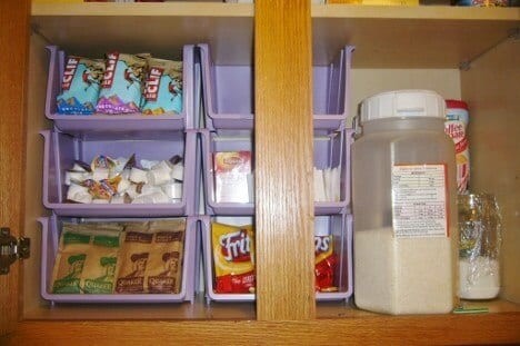 Organize your cupboards with stackable bins.