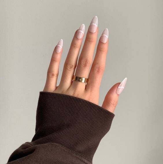 Negative space french tip outline nails.