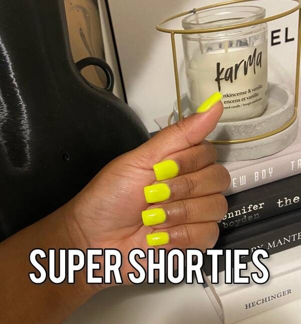 Super short yellow nails.