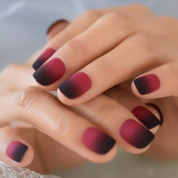 Black and red ombre nail design.