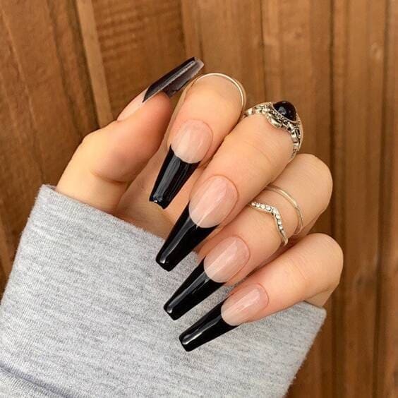 Glossy black french tip nails.