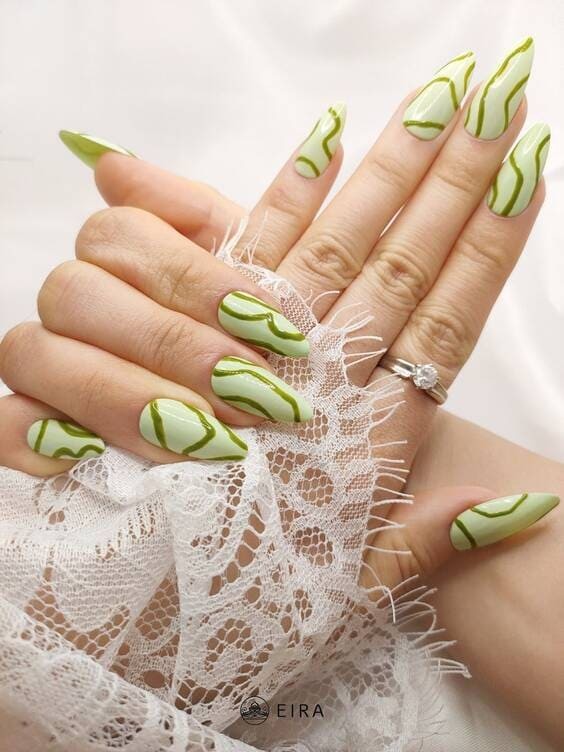 Swirl abstract Pastel green nails.