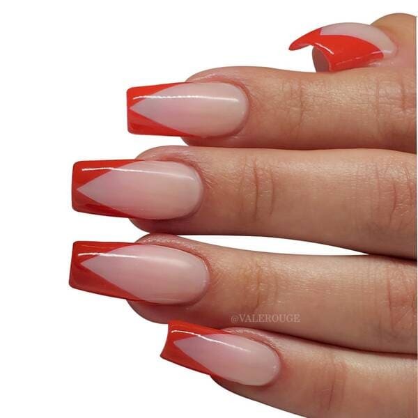 Modern Red colored v tip french tip nails.