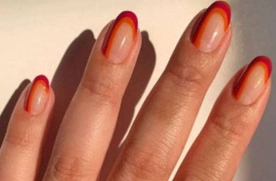 Orange & red stripe french acrylic oval tips.