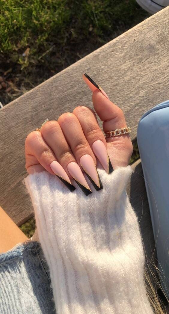 Pink nails with black details and gold.