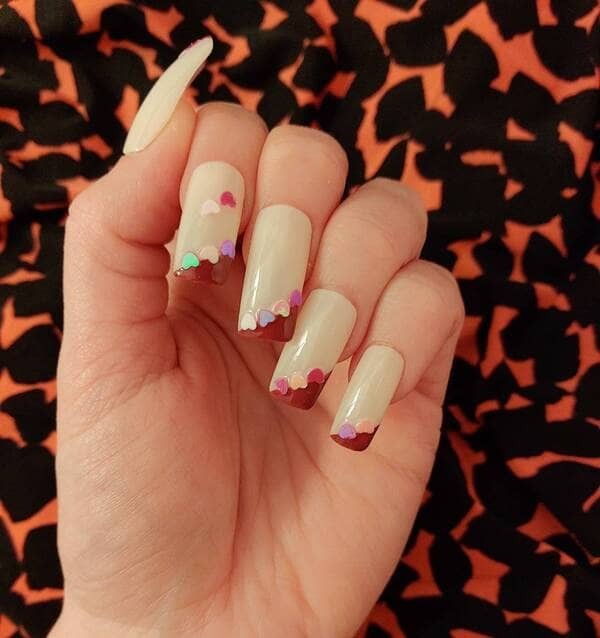 Pink magenta hearts nails.