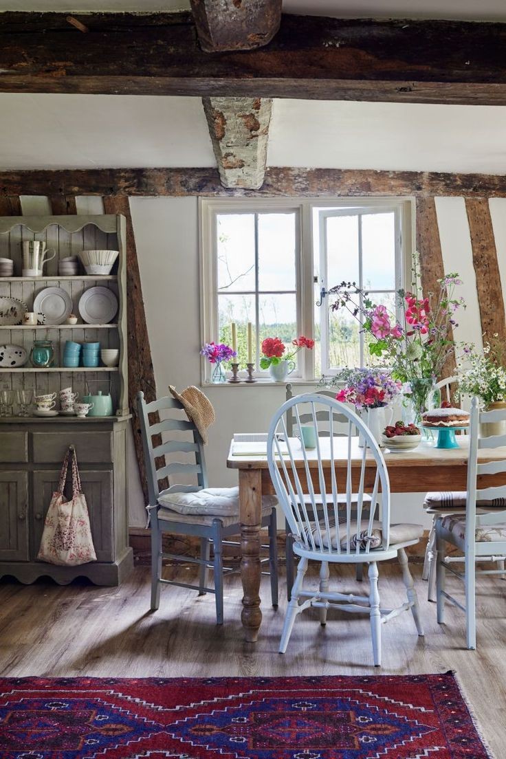 When it comes to creating a cozy English cottage-style kitchen — where you place your table matters.