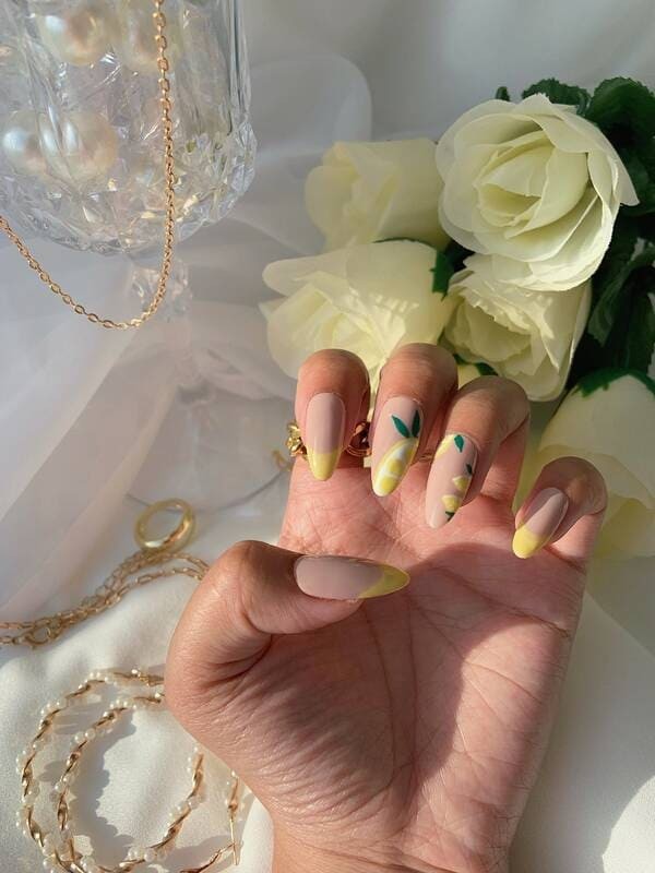 Lemon drop yellow french nails.