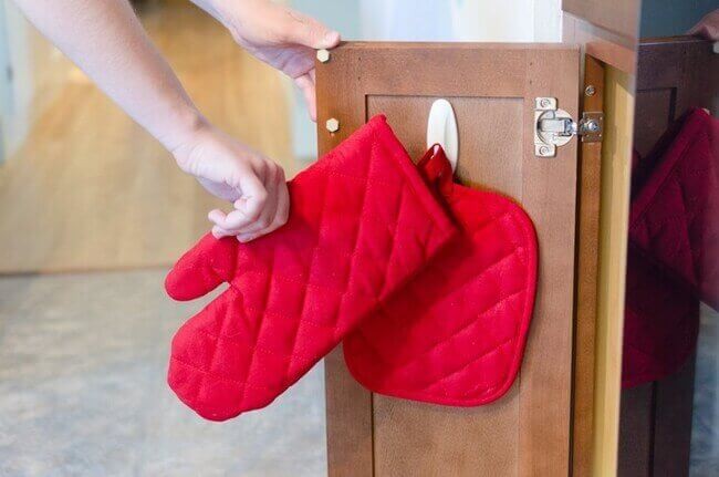 Hang up your oven mitts for easy grabbing.