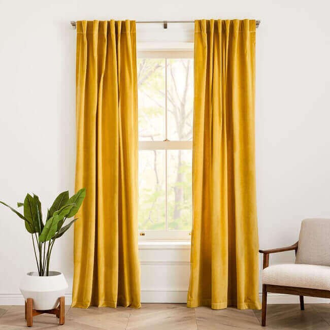 Do a simple Curtain Swap with blackout thermal insulated drapes.