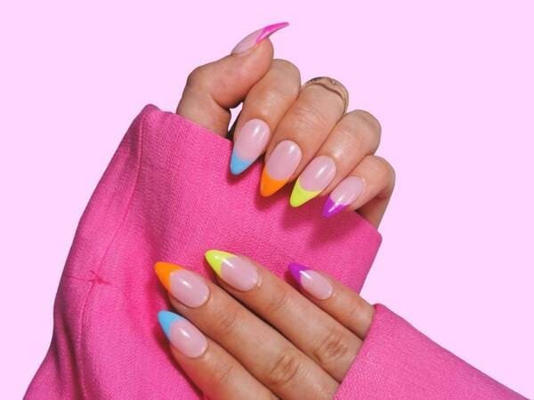 Bright rainbow gradient nails.