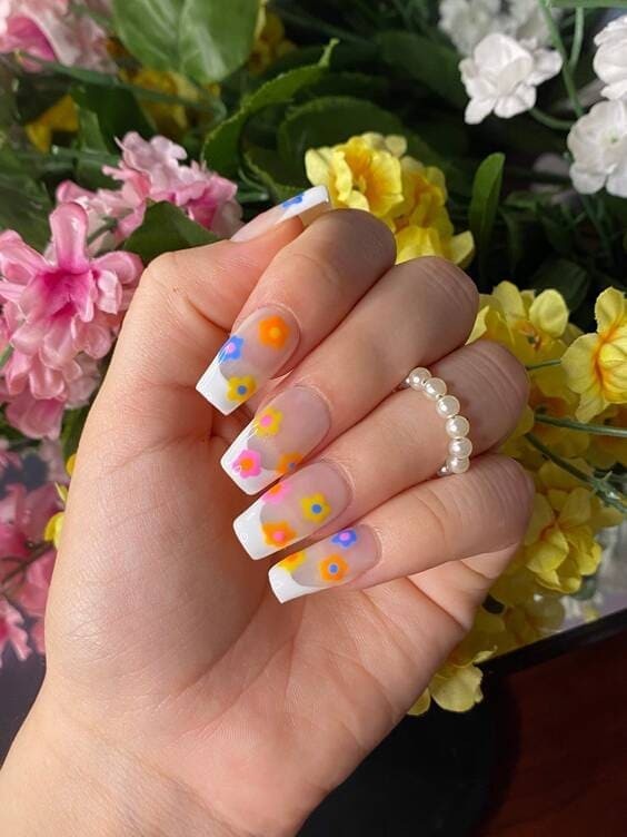 White french tip with colorful flowers.