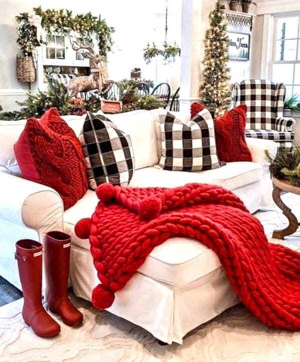 Red knit blanket with Merino wool and Pom poms.