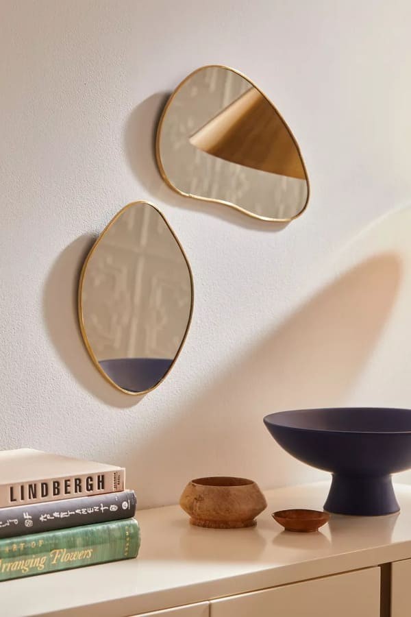 Gold Organic Shaped Wall Mirror by Urban Outfitters.