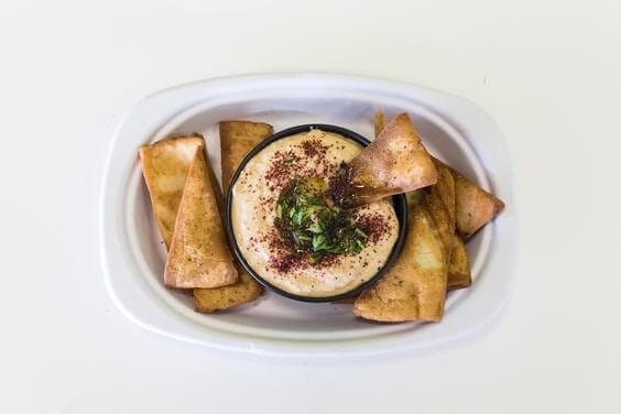 Swap out old carb-heavy dairy dips with hummus.