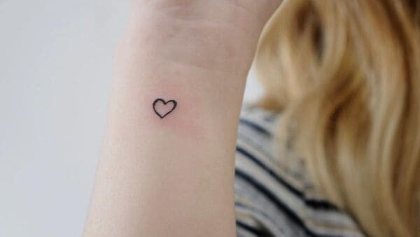 Heart outline on the wrist Tattoo