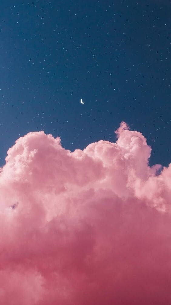 Pink clouds in the starry night sky.