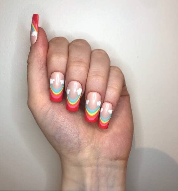 Rainbows and clouds french manicure.