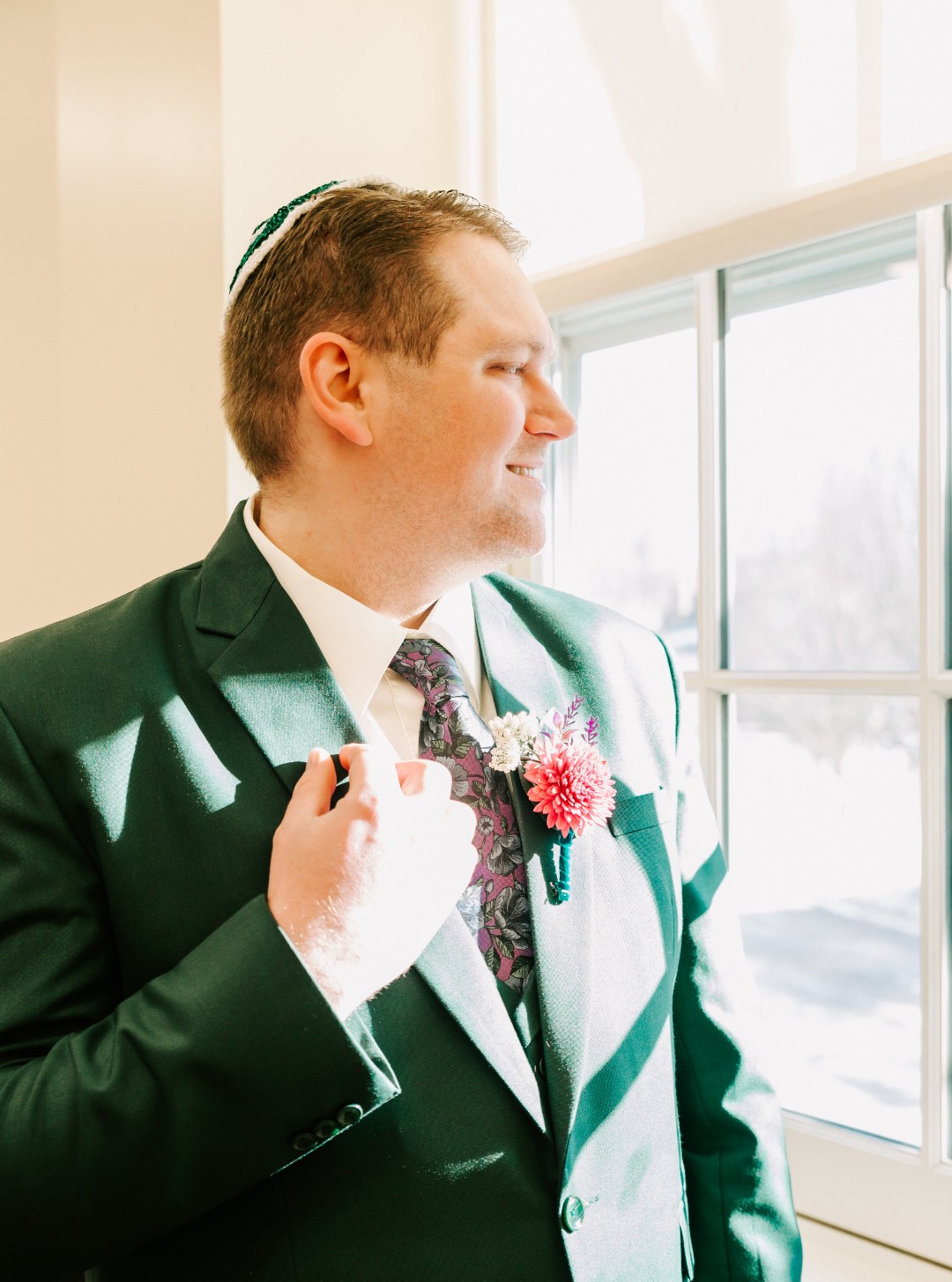 Danya wore a bright pink dress with embroidered flowers, and Chris wore an emerald green suit. The pop of color against the zoo background is simply stunning! If you ever wondered “Is it okay to have a colored wedding dress?” the answer is a resounding YES! I mean, LOOK AT THIS GOWN!