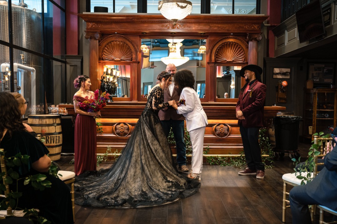 Check out the black wedding cake at this elegant Sleepy Hollow gothic wedding shoot