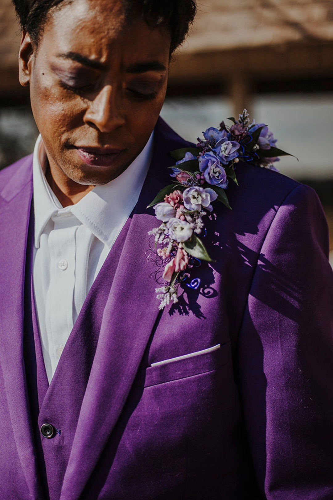 Which do you love more? The super-affordable purple wedding suit from Amazon, or the shoulder corsage?