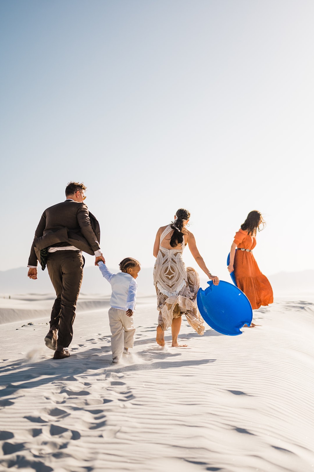 We love that the couple + guests sledded at this White Sands National Park elopement.