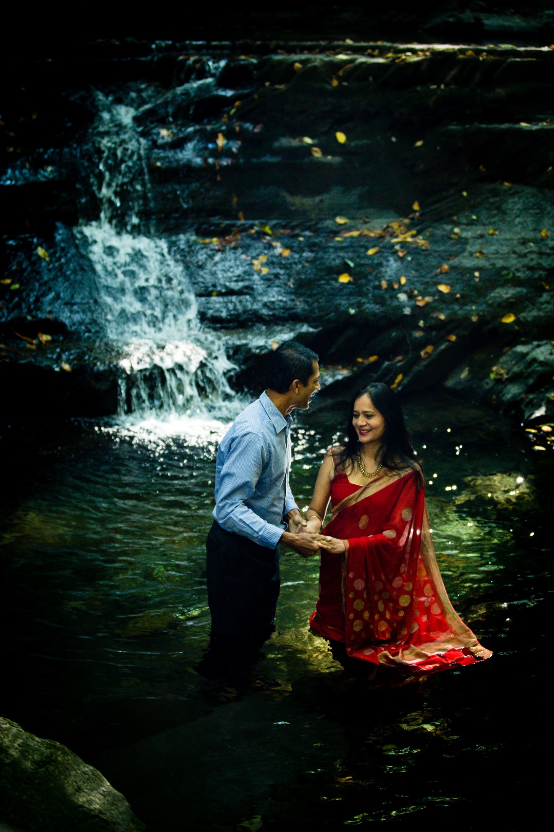 Unique engagement shoot idea #5: This couple honored their Indian traditions in a nontraditional way, resulting in a stunning waterfall photoshoot.