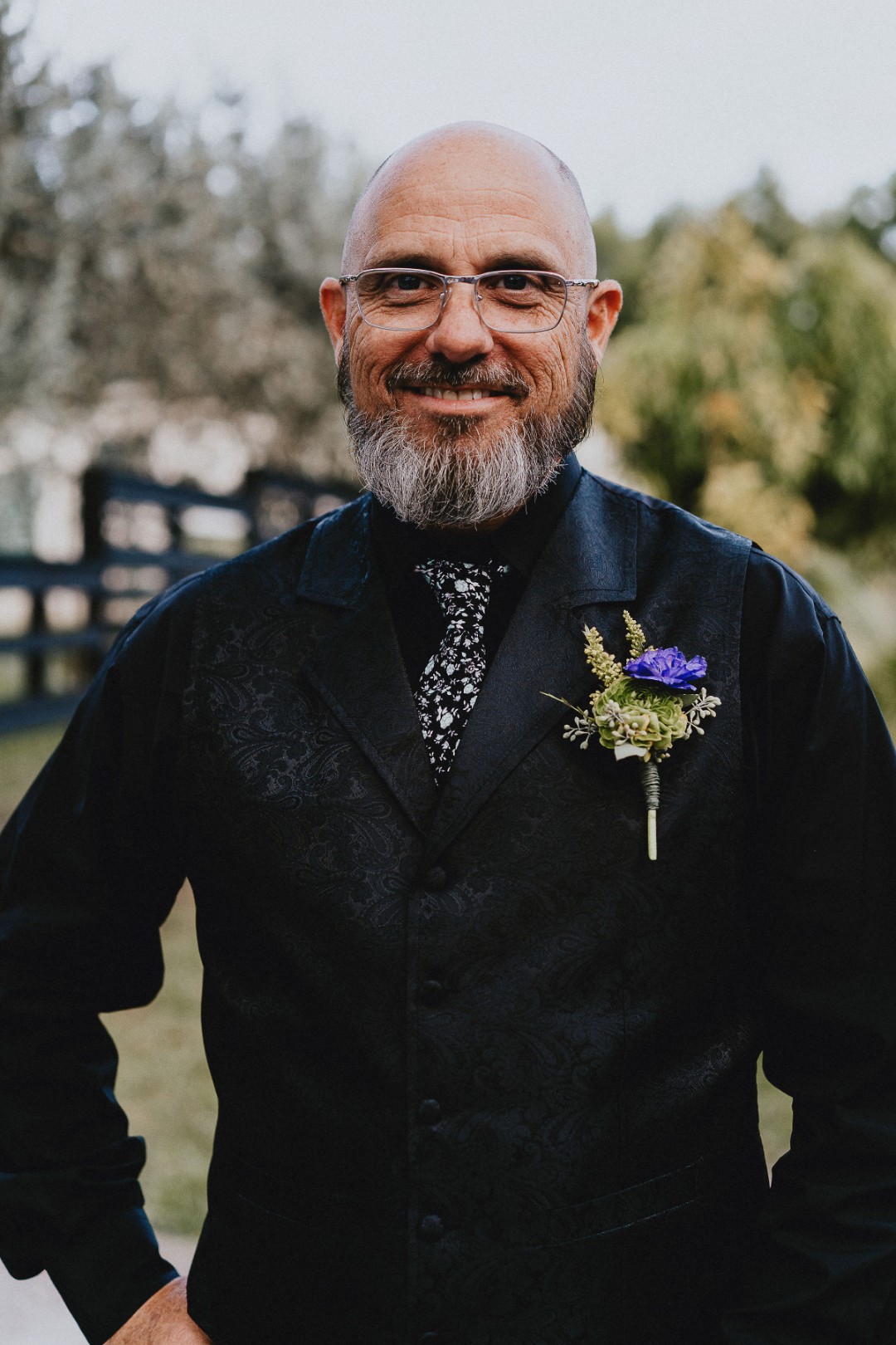 Love the details of this black brocade vest and floral patterned tie.