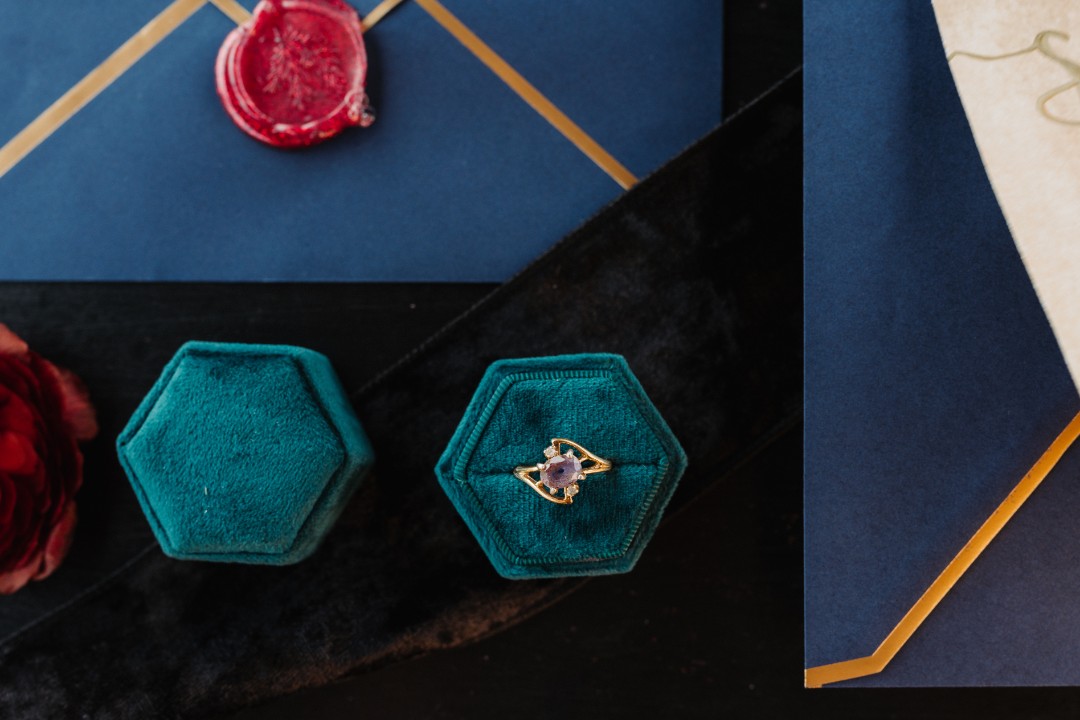 Get lost in this jewel-toned invitation suite and amethyst wedding ring.