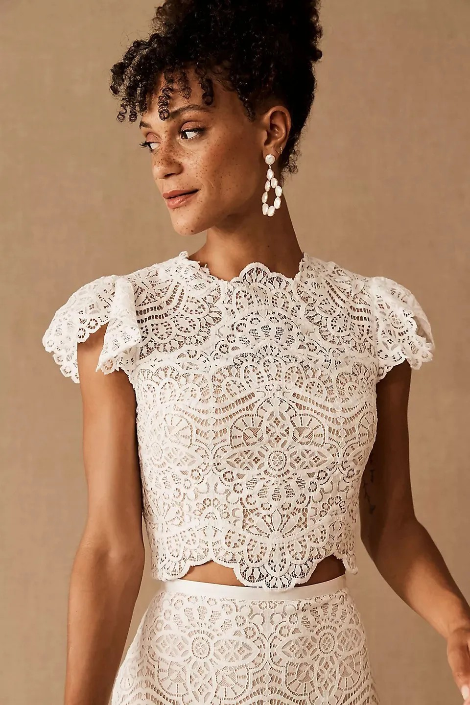 How about a long-sleeved lace crop top with a matching lace midi skirt?