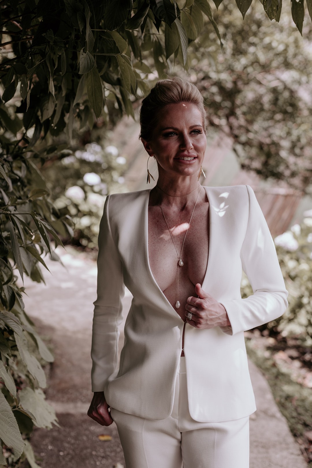 And can we talk about this white suit with the deep v-neck?!