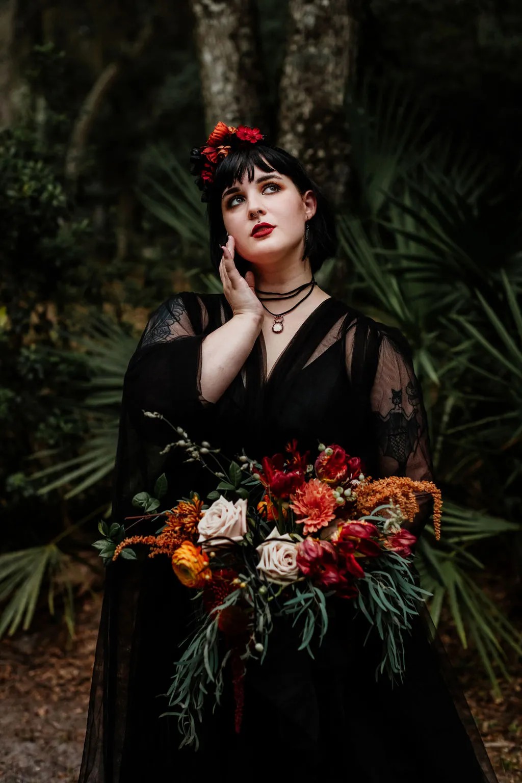 First up: Black wedding dress with that headdress, that Halloween wedding bouquet, and that quartz ring…