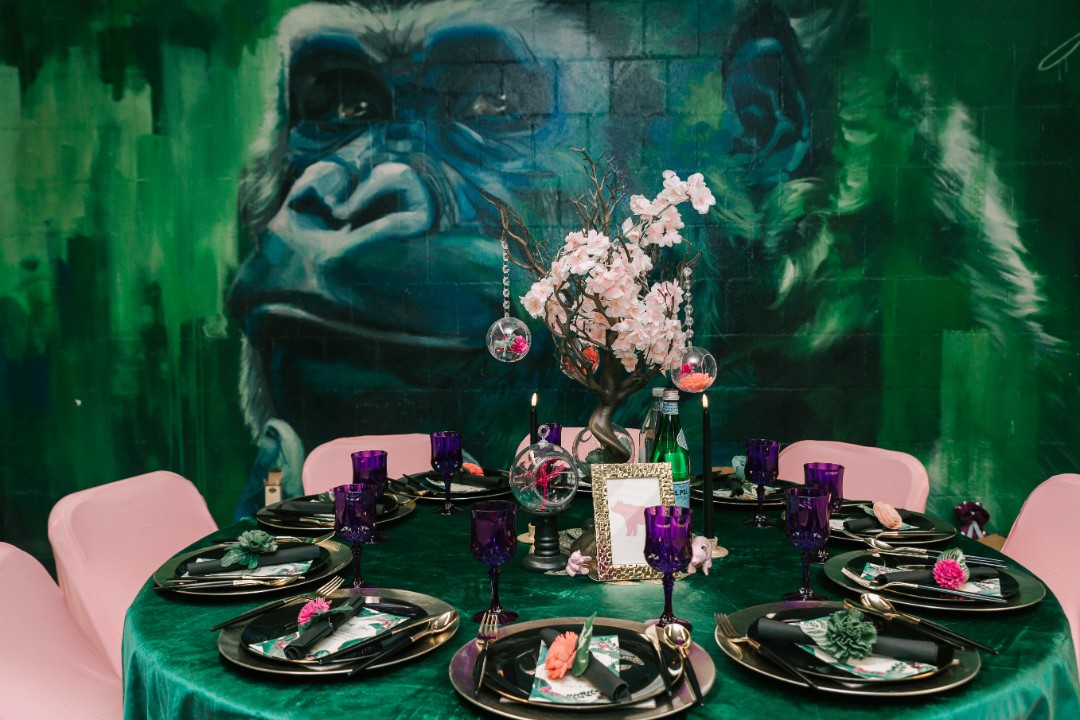 The classroom at Franklin Park Zoo was transformed into a whimsical jungle on the evening of Danya and Chris’ colorful wedding. The table centerpieces at the reception were also animal/nature-themed and absolutely adorable. They were made by the bride herself!