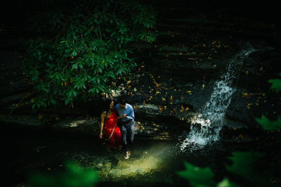 Unique engagement shoot idea #5: This couple honored their Indian traditions in a nontraditional way, resulting in a stunning waterfall photoshoot.