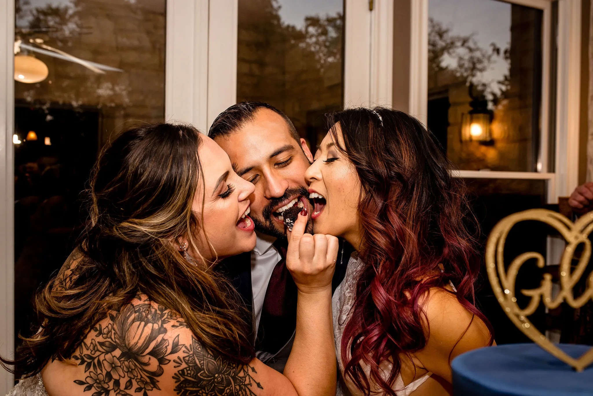 Polyamorous triad wedding reception