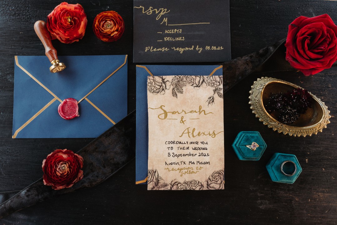 Get lost in this jewel-toned invitation suite and amethyst wedding ring.