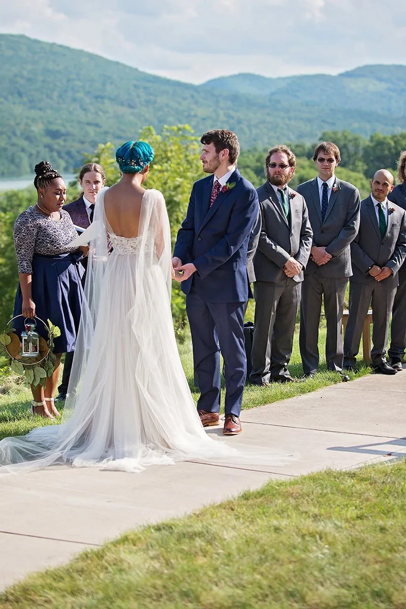 That cape is giving elegant Elven vibes at this Lord of the Rings-inspired wedding!