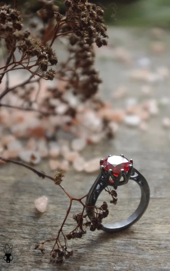 Black wedding rings with red stones