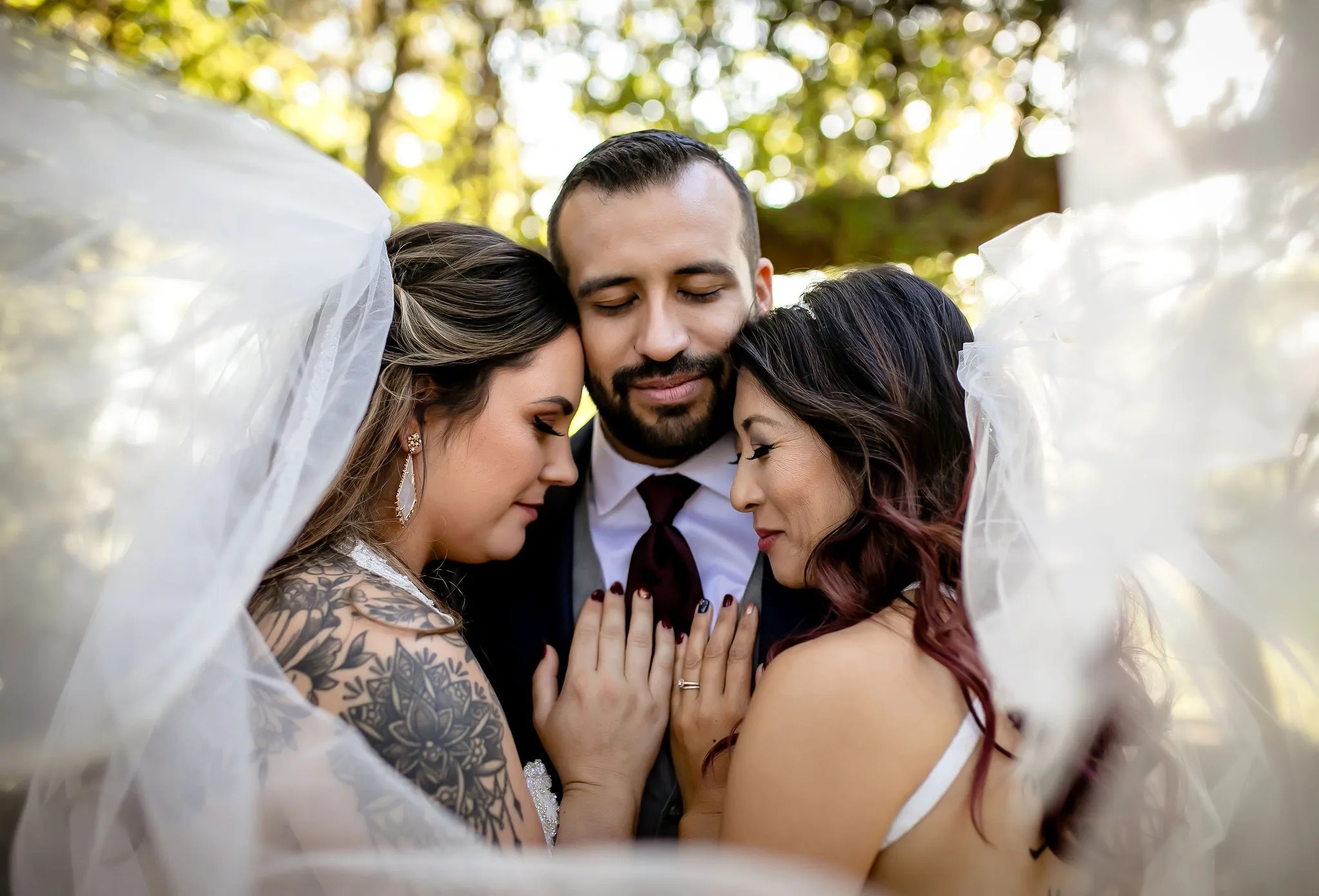 Polyamorous triad wedding portraits