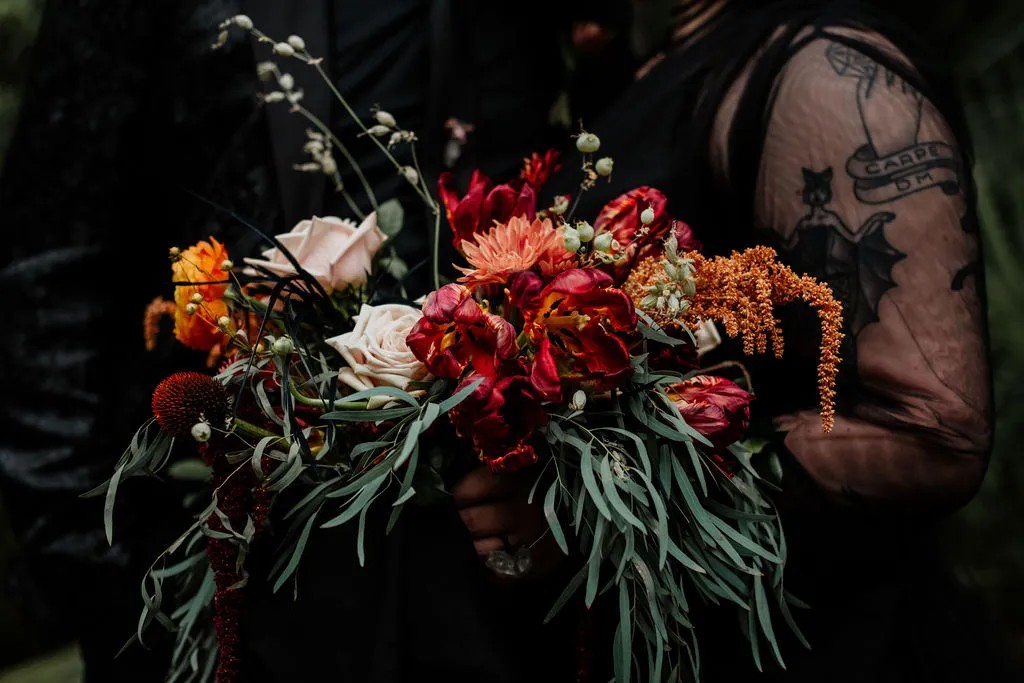 First up: Black wedding dress with that headdress, that Halloween wedding bouquet, and that quartz ring…