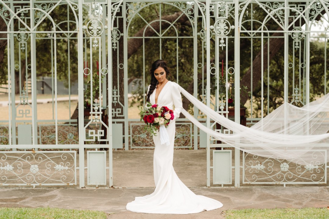 And OMG this long-sleeved wedding dress with trailing tulle wings. Can you imagine how this would look if you wore this while flying on a dragon?!