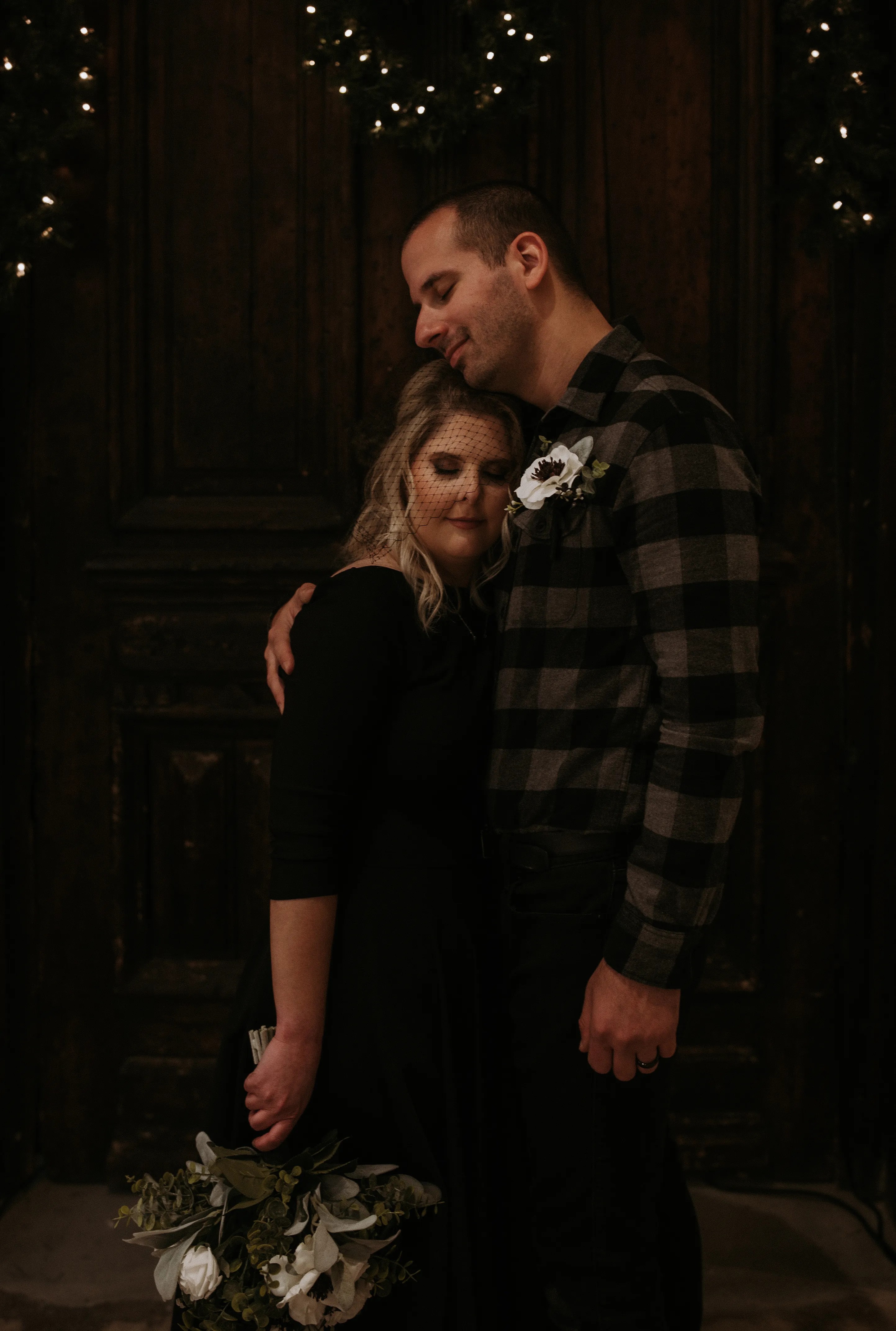 White dahlias, black birdcage veil, AND a black wedding dress?