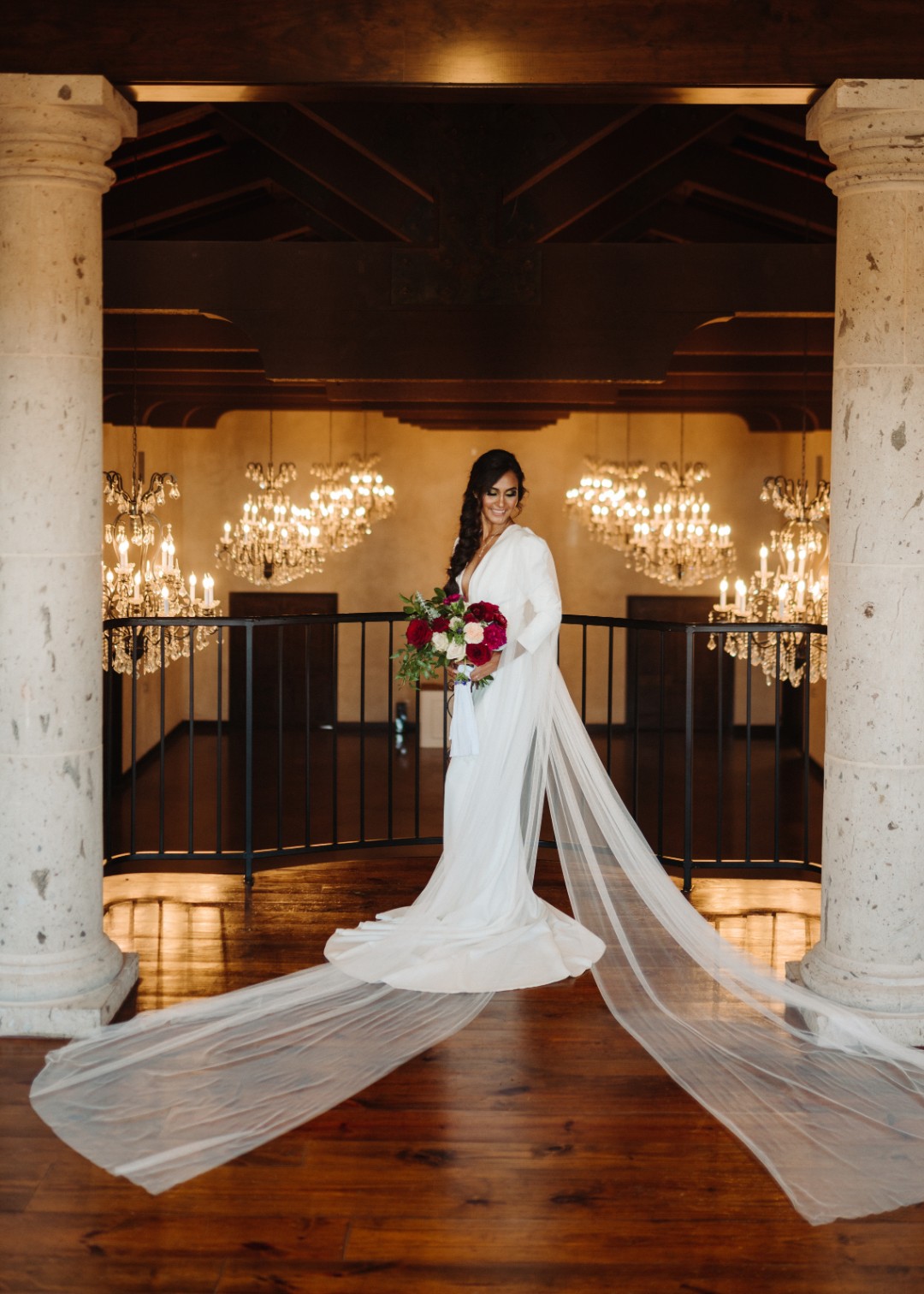 And OMG this long-sleeved wedding dress with trailing tulle wings. Can you imagine how this would look if you wore this while flying on a dragon?!