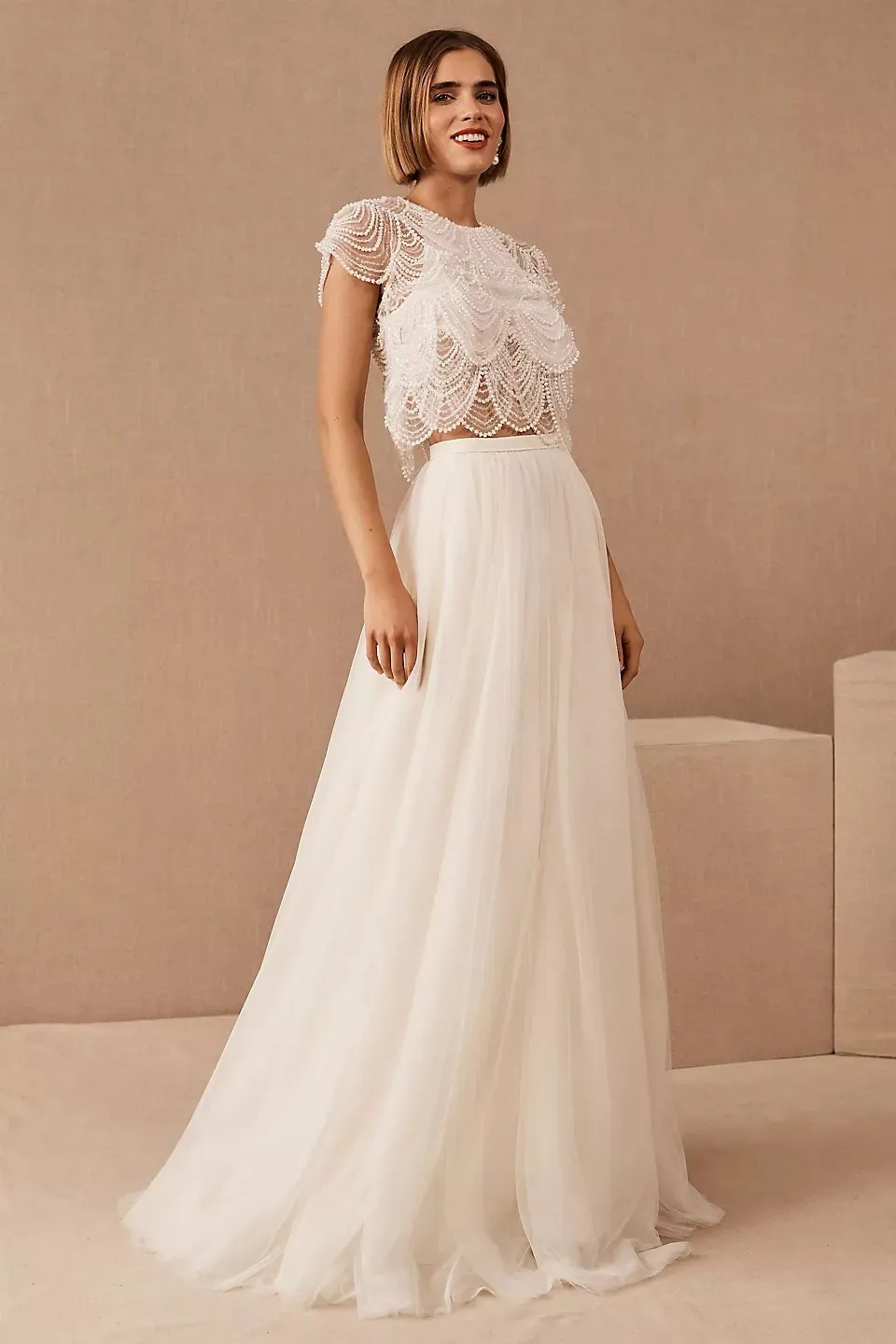 How about a long-sleeved lace crop top with a matching lace midi skirt?