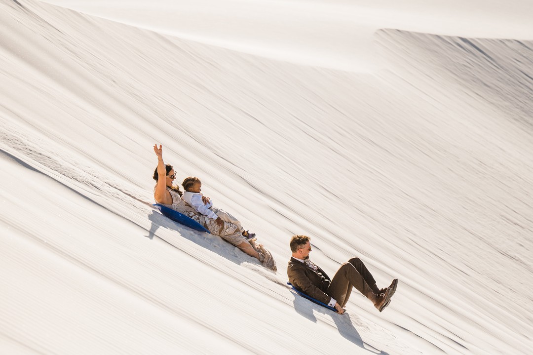 We love that the couple + guests sledded at this White Sands National Park elopement.