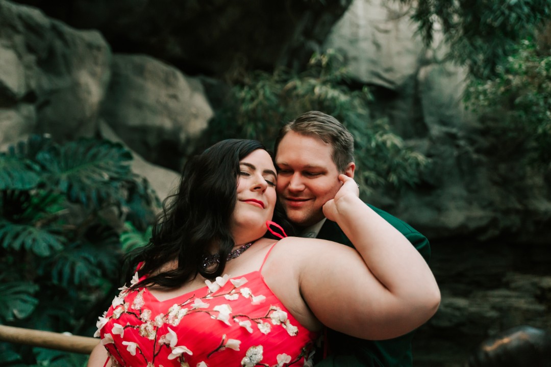 Danya wore a bright pink dress with embroidered flowers, and Chris wore an emerald green suit. The pop of color against the zoo background is simply stunning! If you ever wondered “Is it okay to have a colored wedding dress?” the answer is a resounding YES! I mean, LOOK AT THIS GOWN!